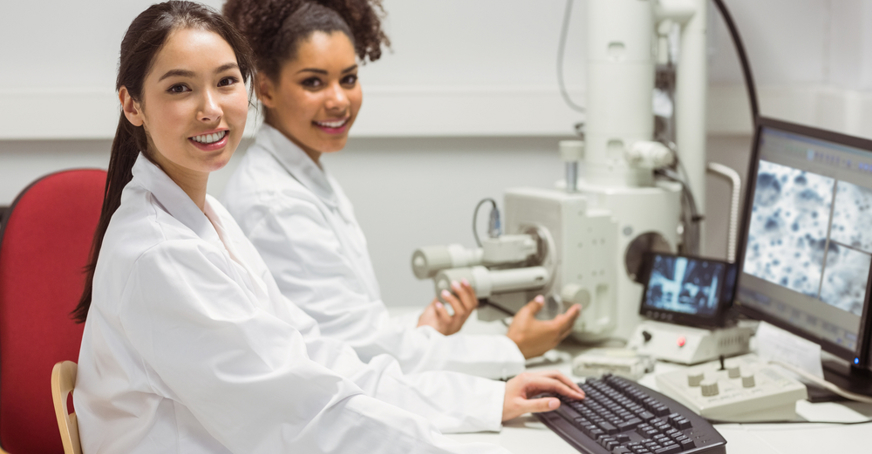 Students working on a computer in a laboratory.